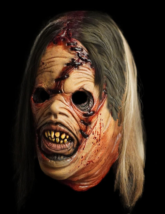 Scary slasher Halloween mask with stitched human face design and mismatched hair patches