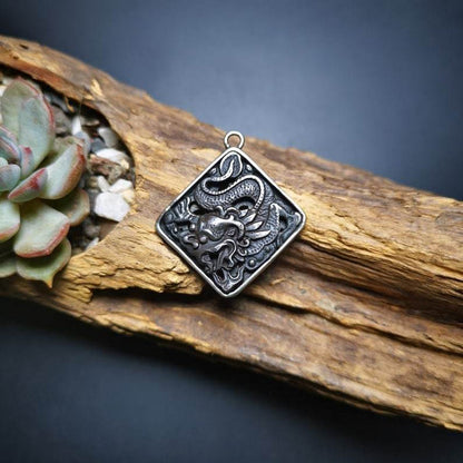 Amulet,Dragon -the Four Dignities - Tibetan Buddhist amulet, detailed view