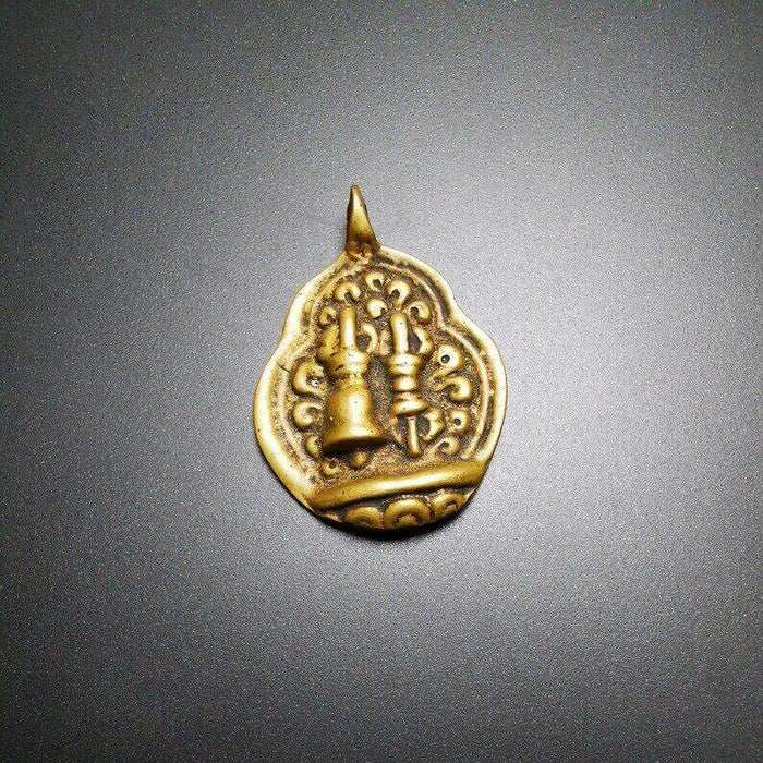 Buddhist Amulet,vajra club and tribu bell Pendant - Tibetan Buddhist amulet, close-up detail