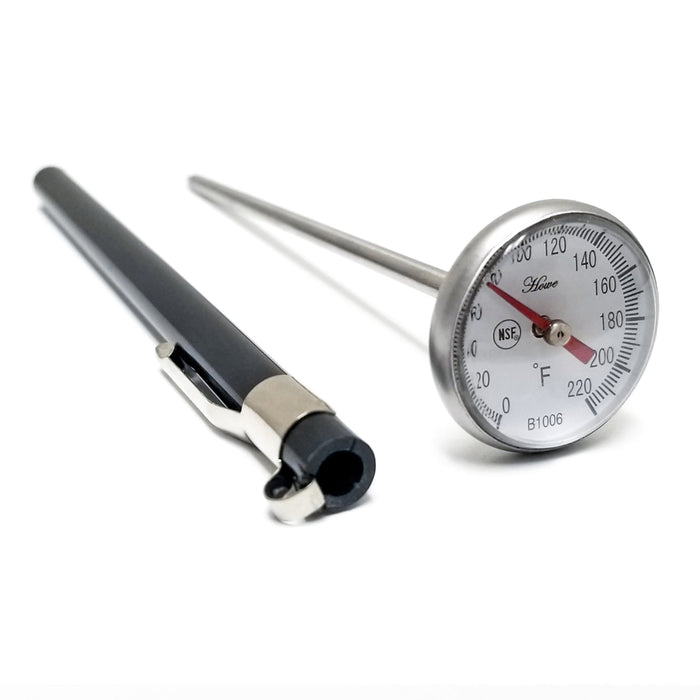 Temperature dial at the top of steel bar. Black case for thermometer sitting next to it.