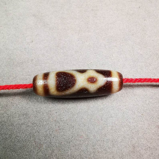 Kubera Dzi Bead - Tibetan dzi bead, front view