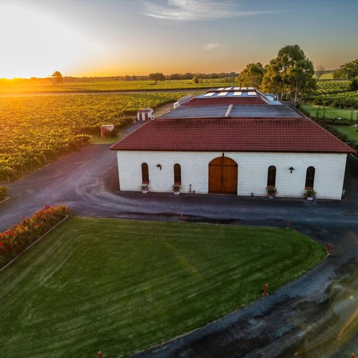 Aerial view of a Leconfield Coonawarra winery and vineyard at sunset.