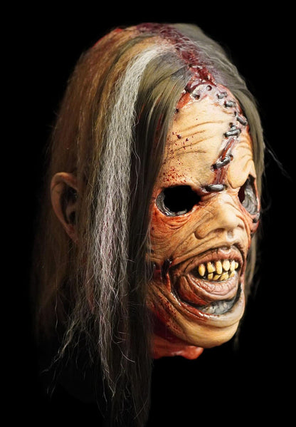 Slaughterhouse Bubba horror mask side view showing hand-laid hair and stitched skin detail